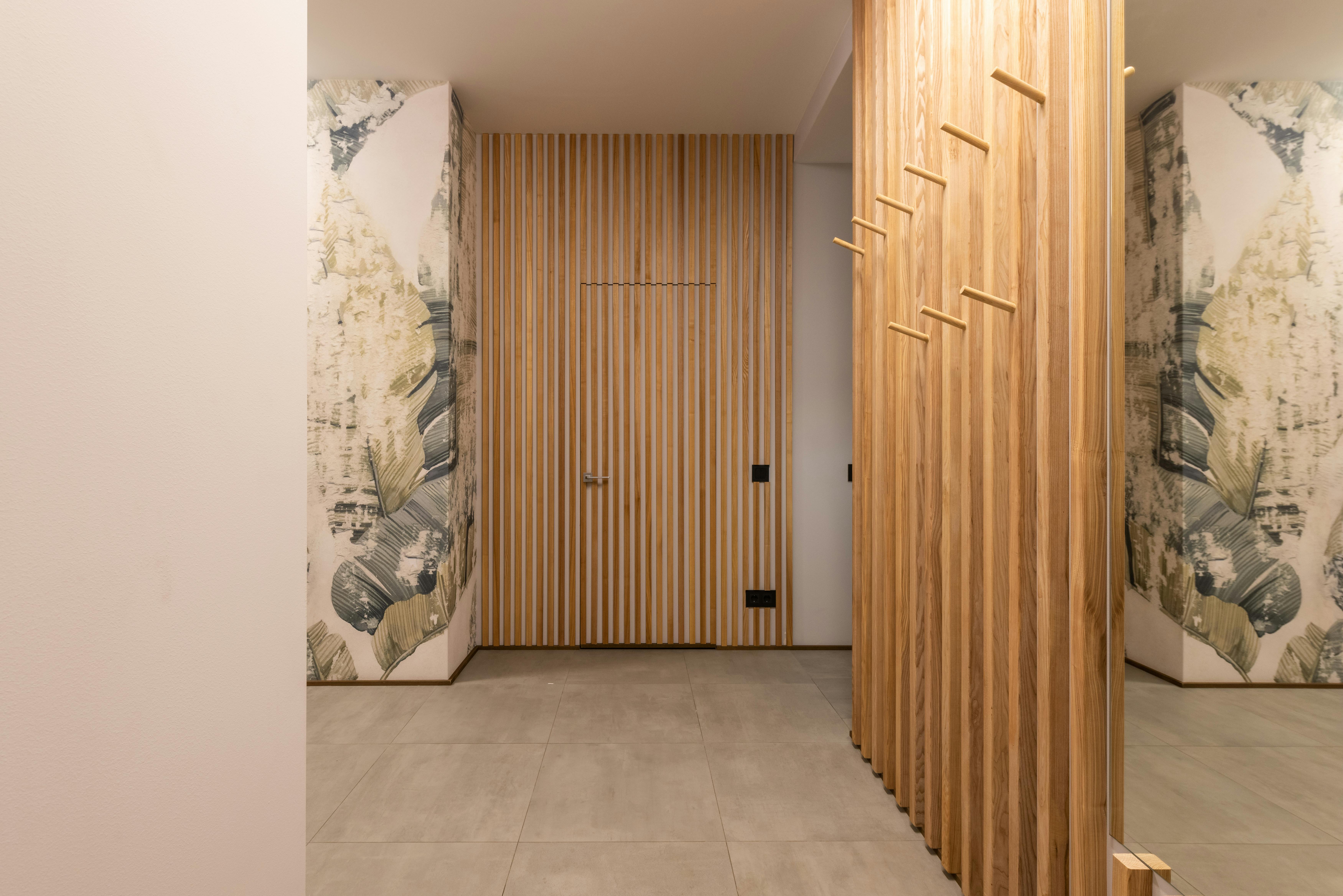 Wood-slat acoustic corridor between rooms