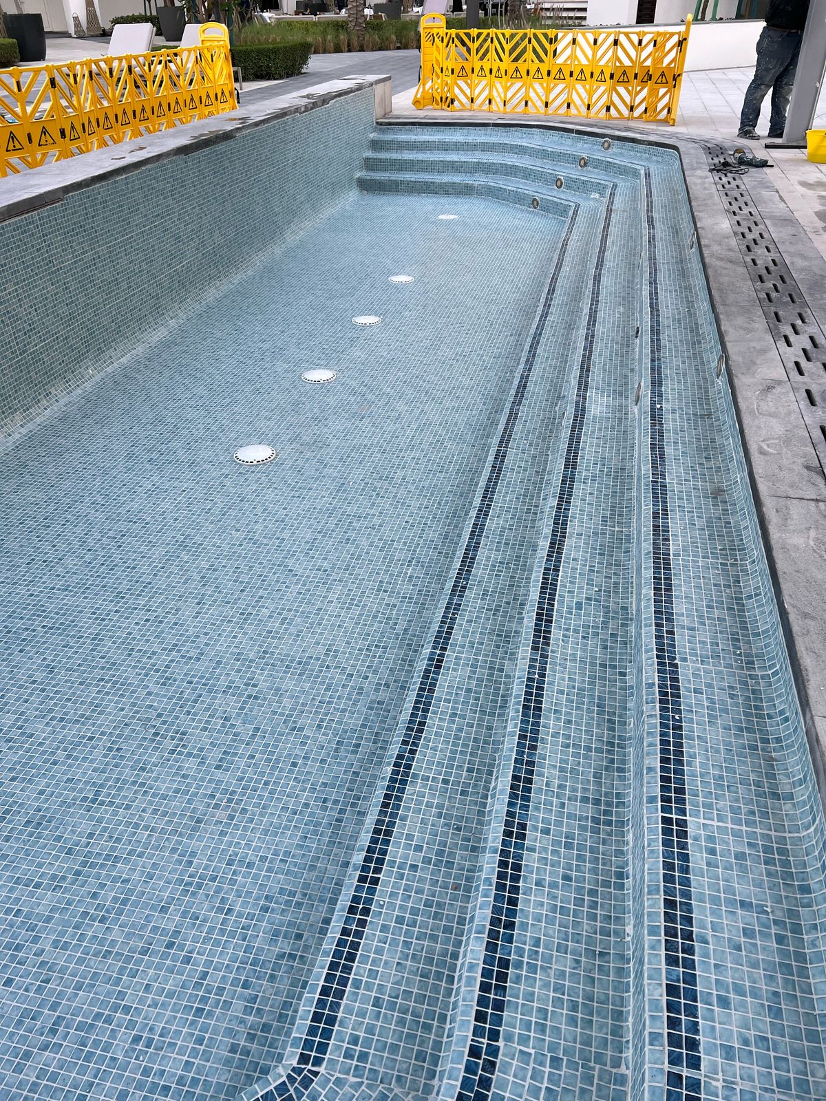 Mosaic pool tile restoration